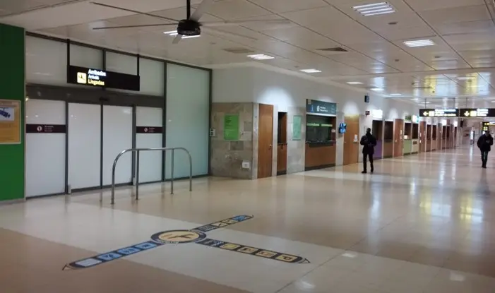 Arrivals area in Girona GRO Airport where your driver will be waiting holding your name on a board