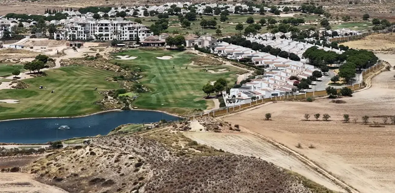 The beautiful desert-style golf course and villas at El Valle Golf Resort, a premier destination serviced by private taxi services from Alicante airport.