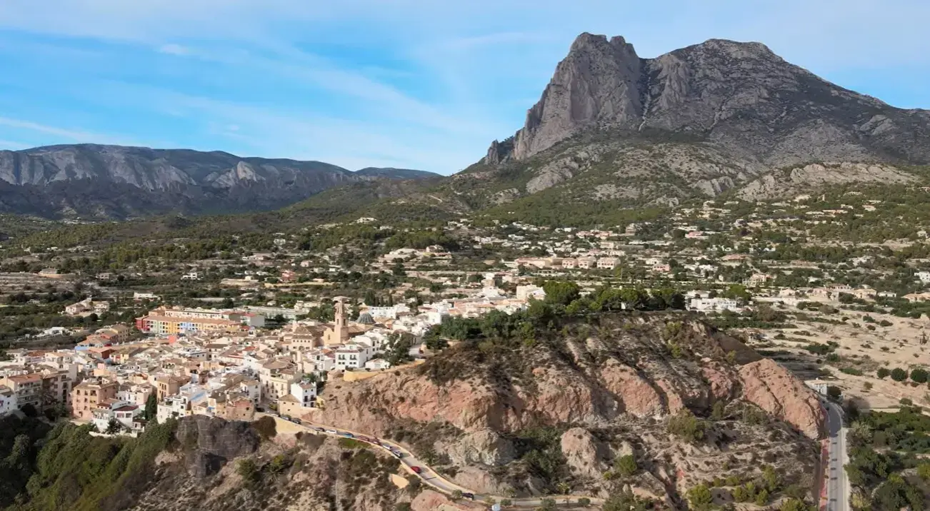 The picturesque town of Finestrat resort nestled under the Puig Campana mountain, a scenic destination reached via private taxi services from Alicante airport.