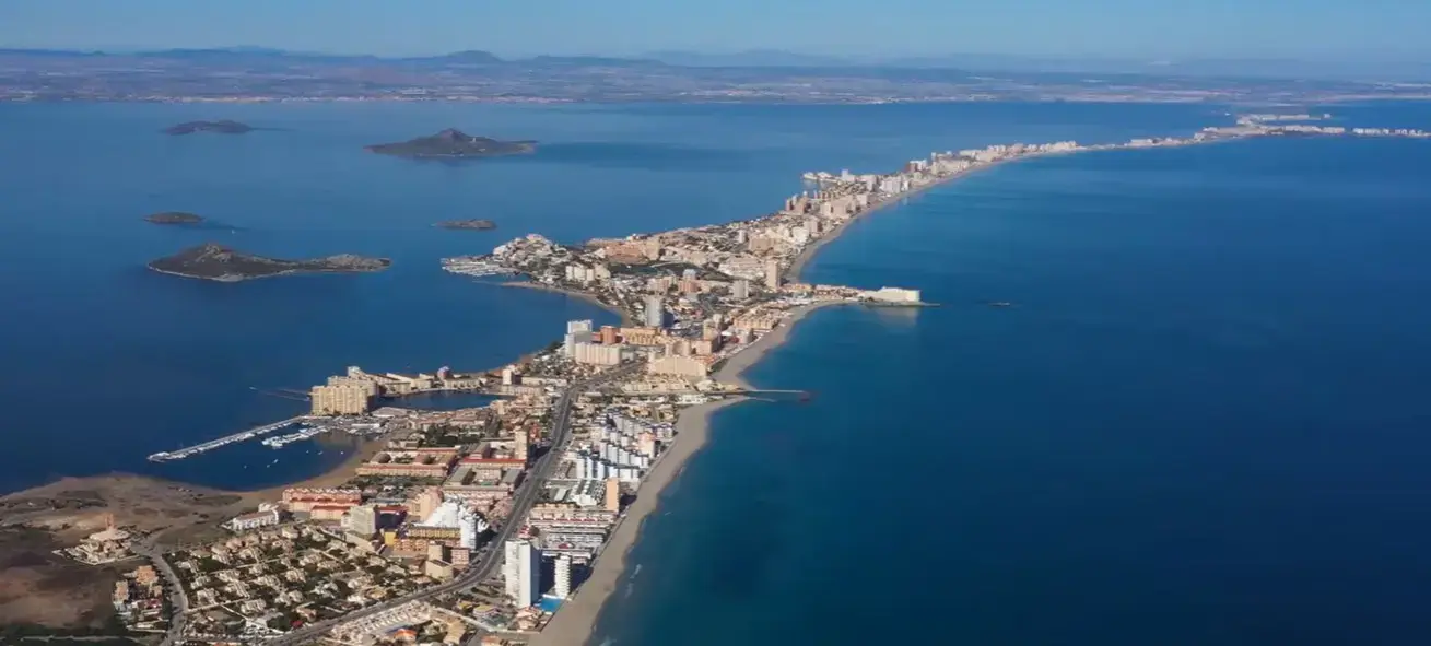 The scenic coastal strip of La Manga Del Mar Menor resort separating the two seas, a popular holiday destination reached via private taxi services from Alicante airport.