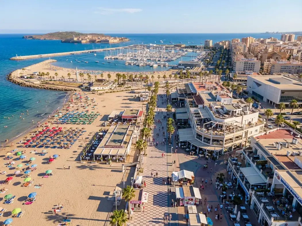 The vibrant promenade and beach area in Torrevieja resort, a top holiday destination reached via private taxi services from Alicante airport.