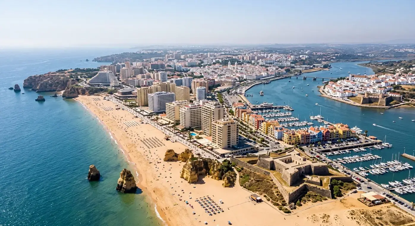 Book cheap-taxis.com private transfers from Faro Airport to Portimao, a bustling riverside resort town famous for its expansive Praia da Rocha beach and lively marina.