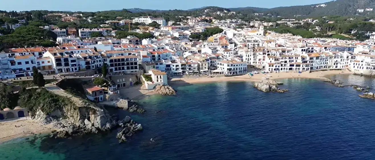 The picturesque coastal beachfront of Calella de Palafrugell, a top destination for Cheap Taxis private shuttle services from Girona Airport.