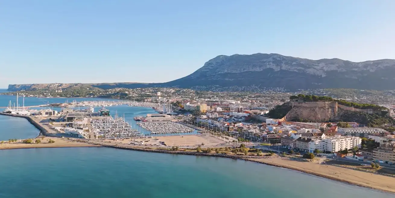 The historic castle and marina at Denia resort, a popular holiday destination reached via private taxi services from Alicante airport