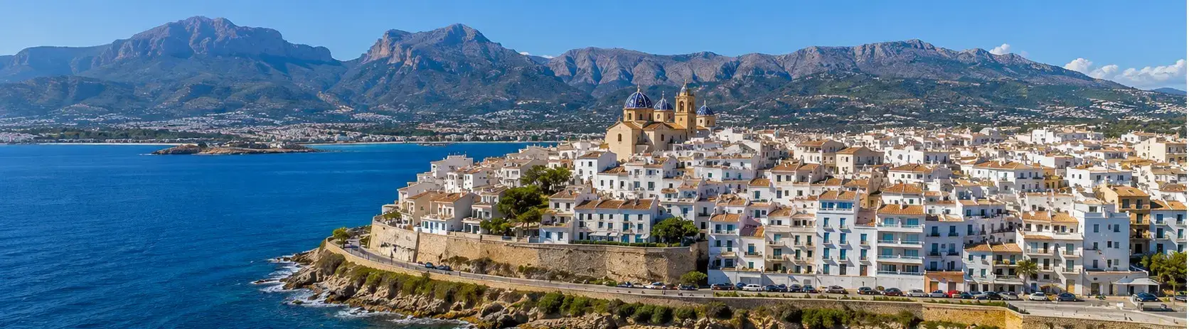 The famous blue-domed church in Altea old town resort, a top destination for travelers using private taxi services from Alicante airport.