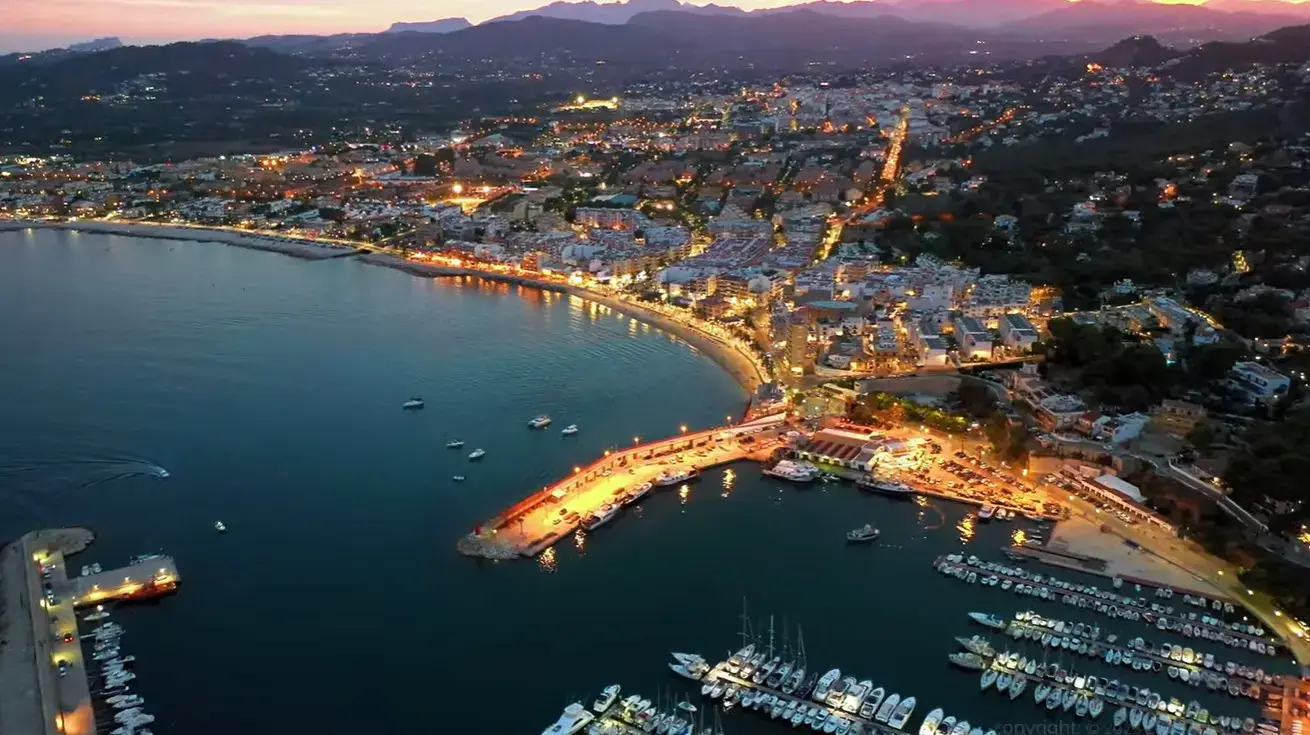 The scenic evening coastline in Javea resort, a popular holiday destination reached via private taxi services from Alicante airport
