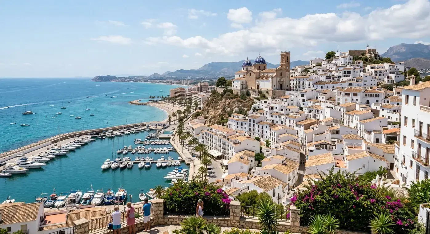Whitewashed buildings and iconic blue-domed church of the coastal resort of Altea for private taxi airport transfers from Valencia Airport by cheap-taxis.com