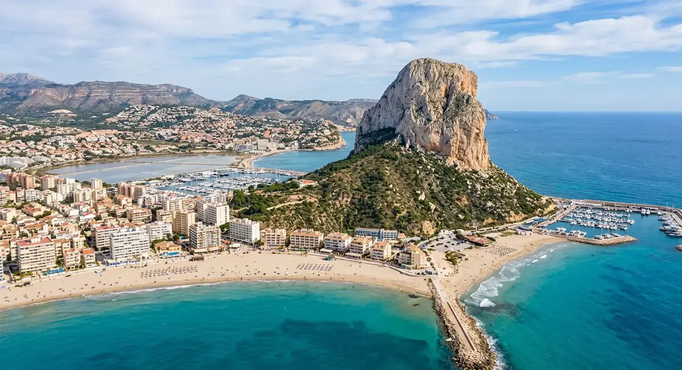 Dramatic Penon de Ifach rock formation and sandy bays of the coastal resort of Calpe for private taxi airport transfers from Valencia Airport by cheap-taxis.com