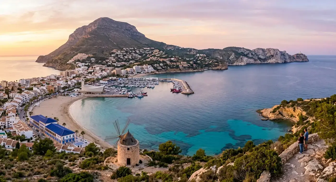 Dramatic coastal cliffs and sandy Arenal beach of the coastal resort of Javea for private taxi airport transfers from Valencia Airport by cheap-taxis.com